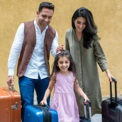 family-with-luggage-girl-with-pink-dress